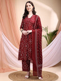 A maroon A-line cotton kurta with Bandhni print, V-neck, 3/4th sleeves, matching pants, and a coordinated dupatta.