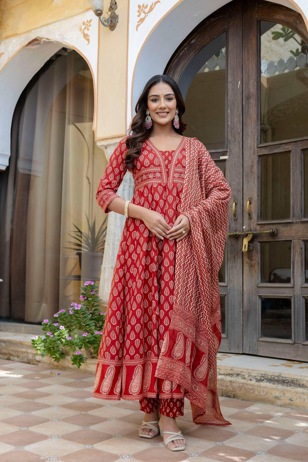 Rust colored ethnic printed Anarkali kurta with matching pants and dupatta