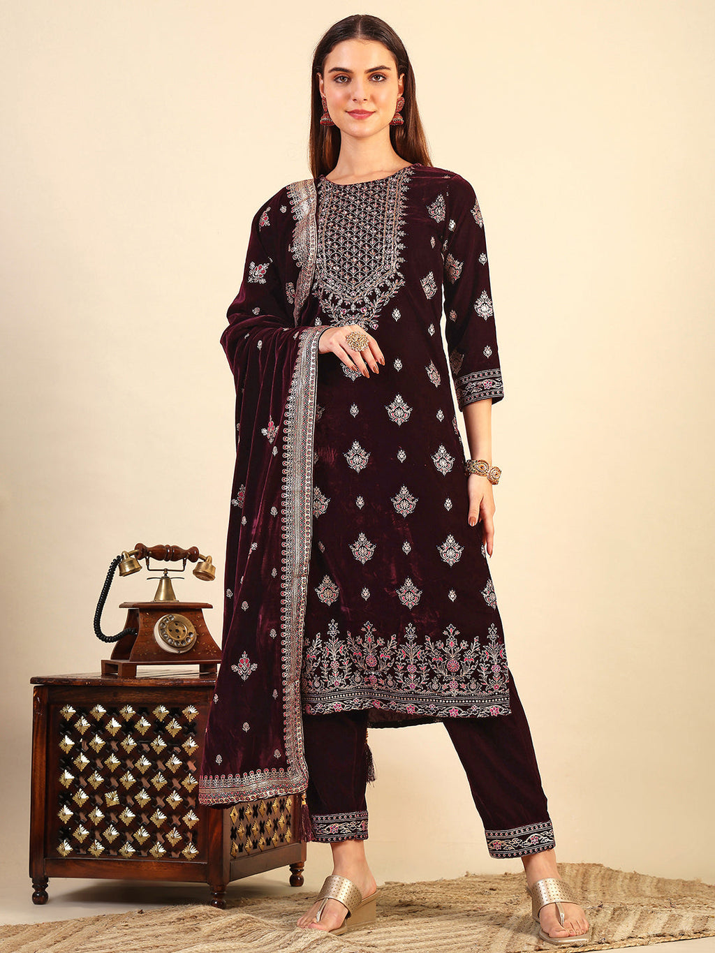 Wine color velvet kurta set with gold foil print detailing, including matching pants and dupatta.