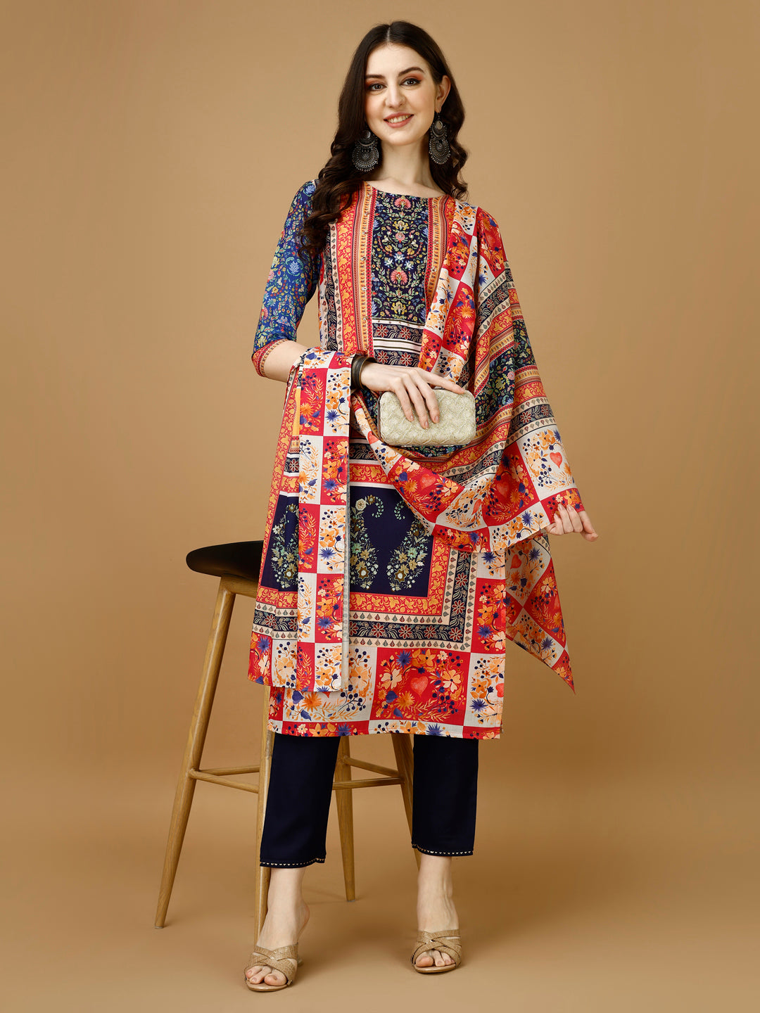 Multicolor hand-embroidered and printed kurta set with matching pants and dupatta.