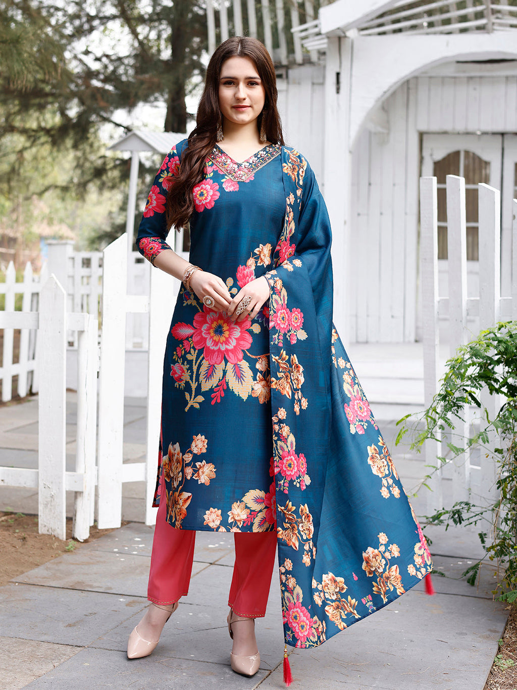 Close-up of a floral printed muslin kurta with hand embroidery detail and matching dupatta.