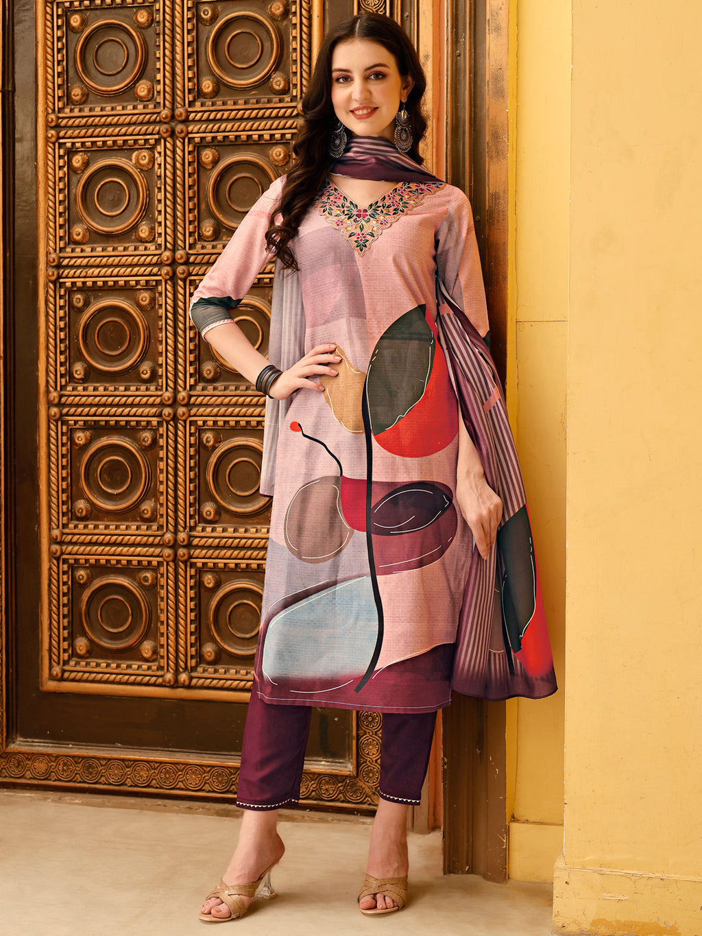 Multicolor floral printed rayon kurta with embroidery, paired with matching pants and printed dupatta.
