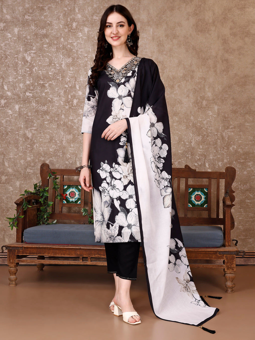 Model wearing a premium black cotton kurta set with floral prints, embroidery, matching pant, and printed dupatta