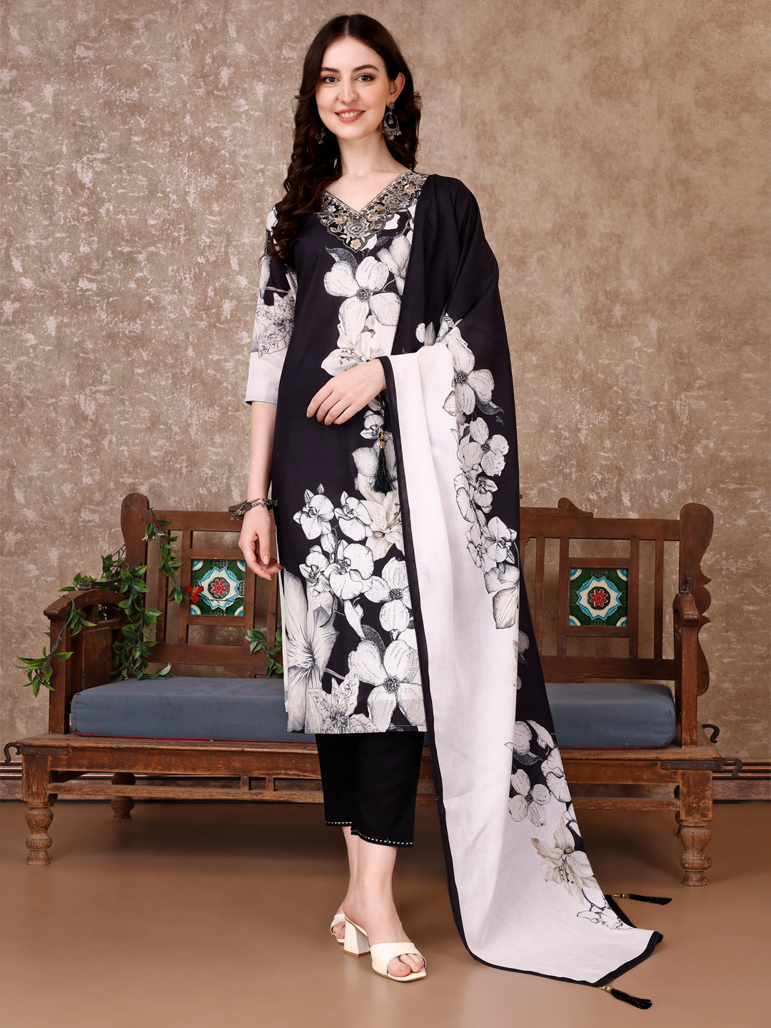 Model wearing a premium black cotton kurta set with floral prints, embroidery, matching pant, and printed dupatta