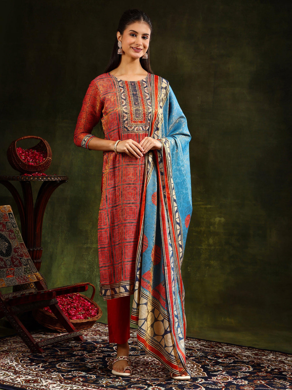 Rust colored pure silk jacquard kurta set with hand embroidery and matching silk dupatta.