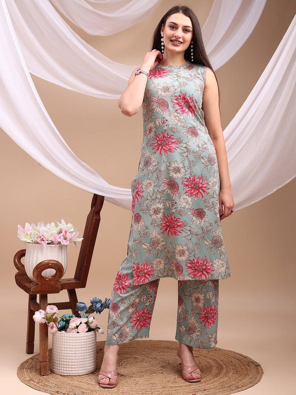 Turquoise rayon kurta with floral print paired with matching palazzo pants