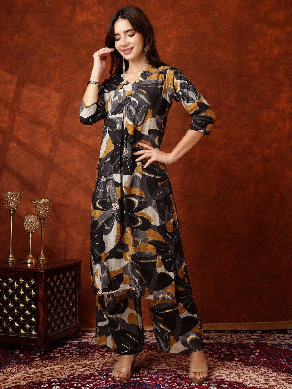 Black floral print kurta with matching palazzo pants.