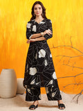 Woman wearing a black cotton printed kurta with matching palazzo pants
