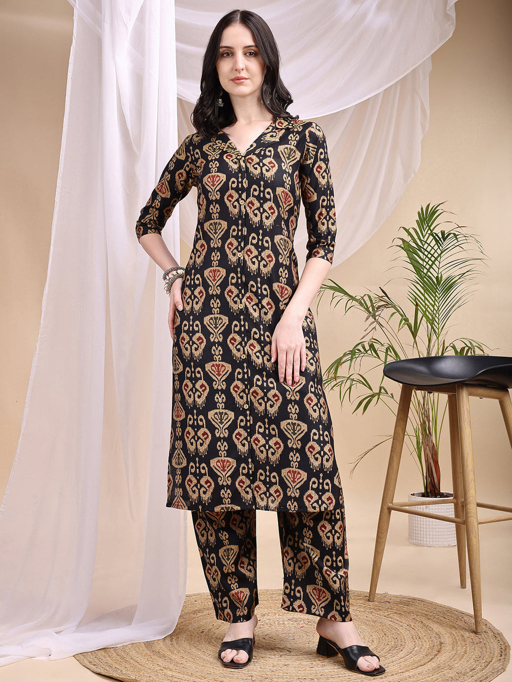 Elegant black kurta featuring traditional Ikat print paired with matching palazzo pants