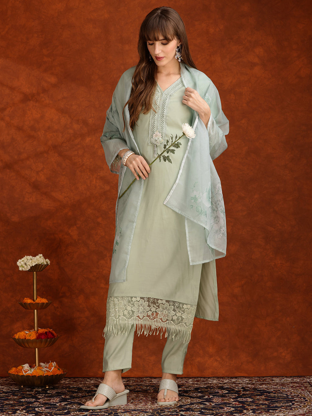 Elegant green Chanderi kurta featuring artificial floral accents and lace trim with matching pant and dupatta