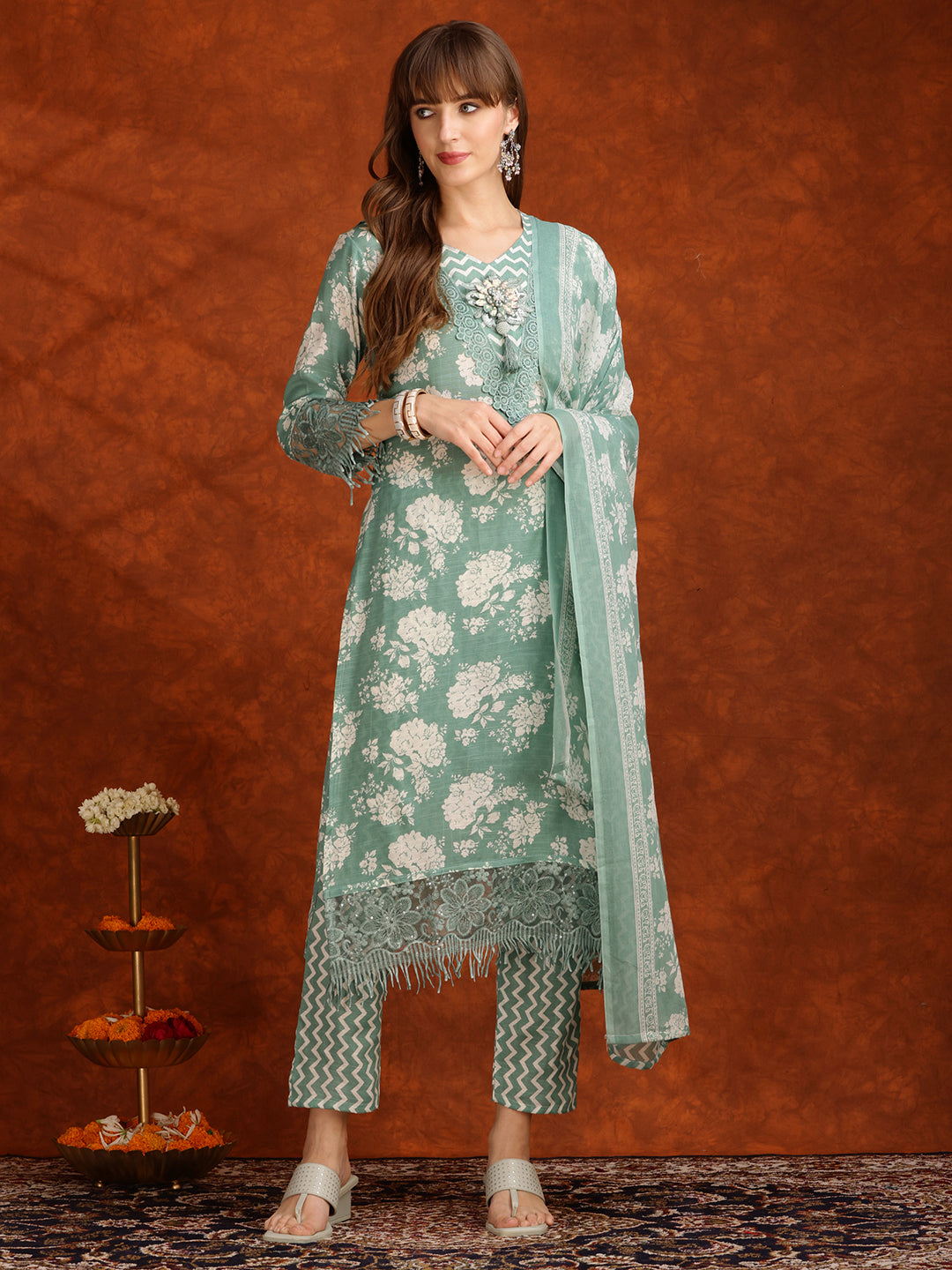 Hiral Fashion green floral embellished kurta paired with matching pants and dupatta
