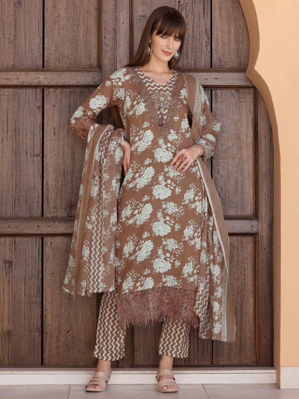 Brown floral printed kurta set with delicate flower embellishments and matching dupatta