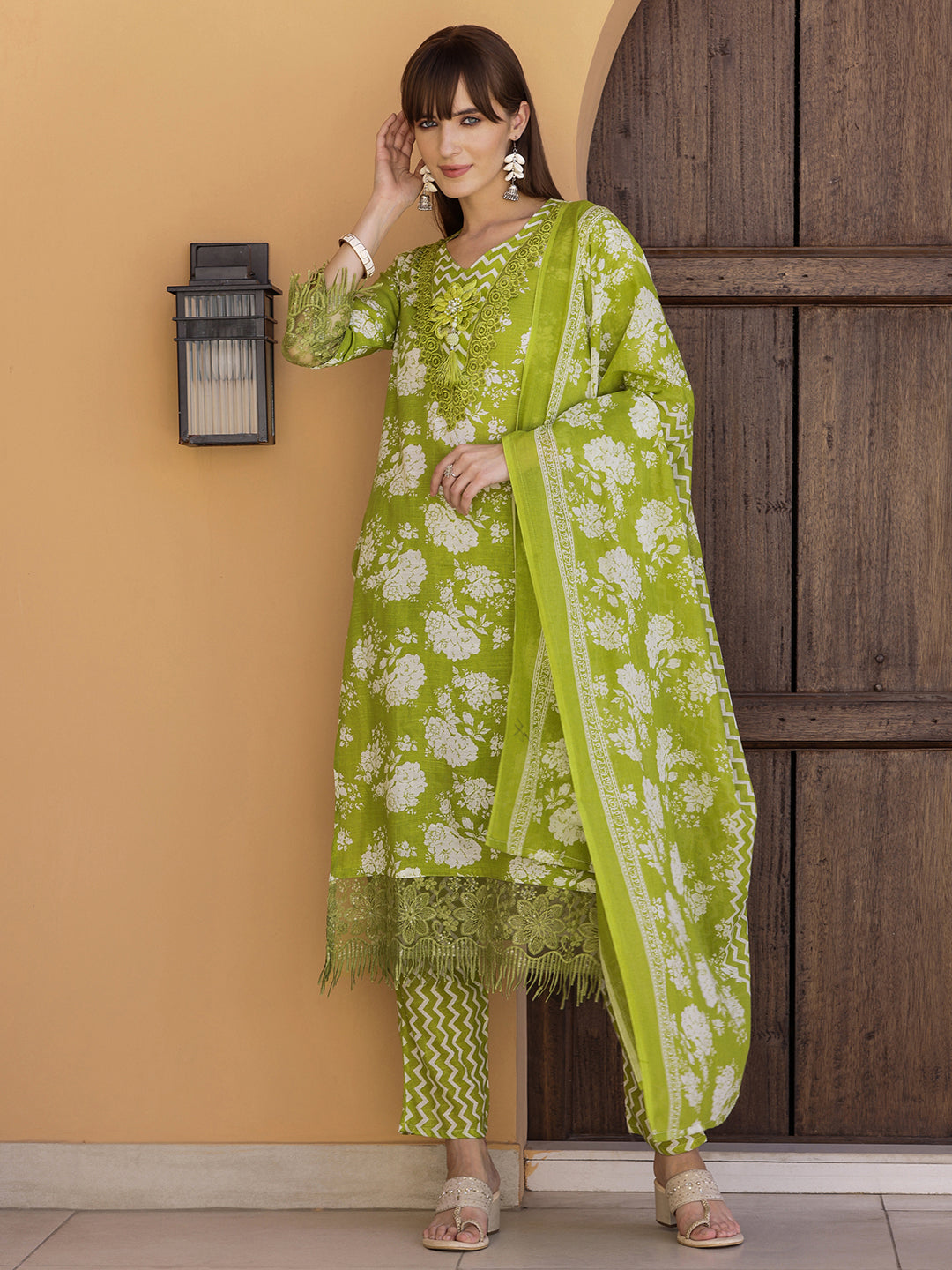 Flower embellished green kurta with matching pant and dupatta, crafted in cotton-blend fabric