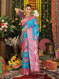 Elegant sky blue silk saree paired with a contrasting purple blouse piece.