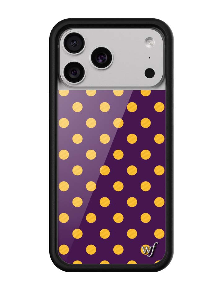 A sleek iPhone case with a dark purple background and bright yellow polka dot print featuring a black rubber bumper.