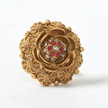 Elegant gold-polished adjustable finger ring featuring intricate stone-studded traditional design.