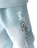 Child wearing comfortable, oversized cargo sweatpants with a clean waistband, perfect for play.