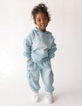Child wearing a cozy, oversized faith-inspired Kingdom Kids hoodie