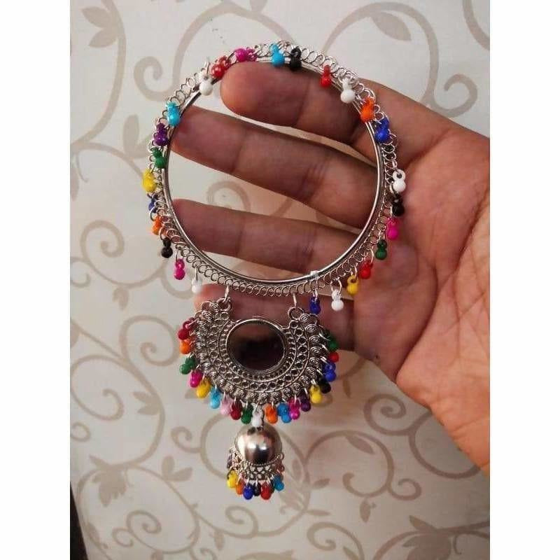 Silver-toned bangle adorned with multicolor pearls and a mirror-design jhumka charm