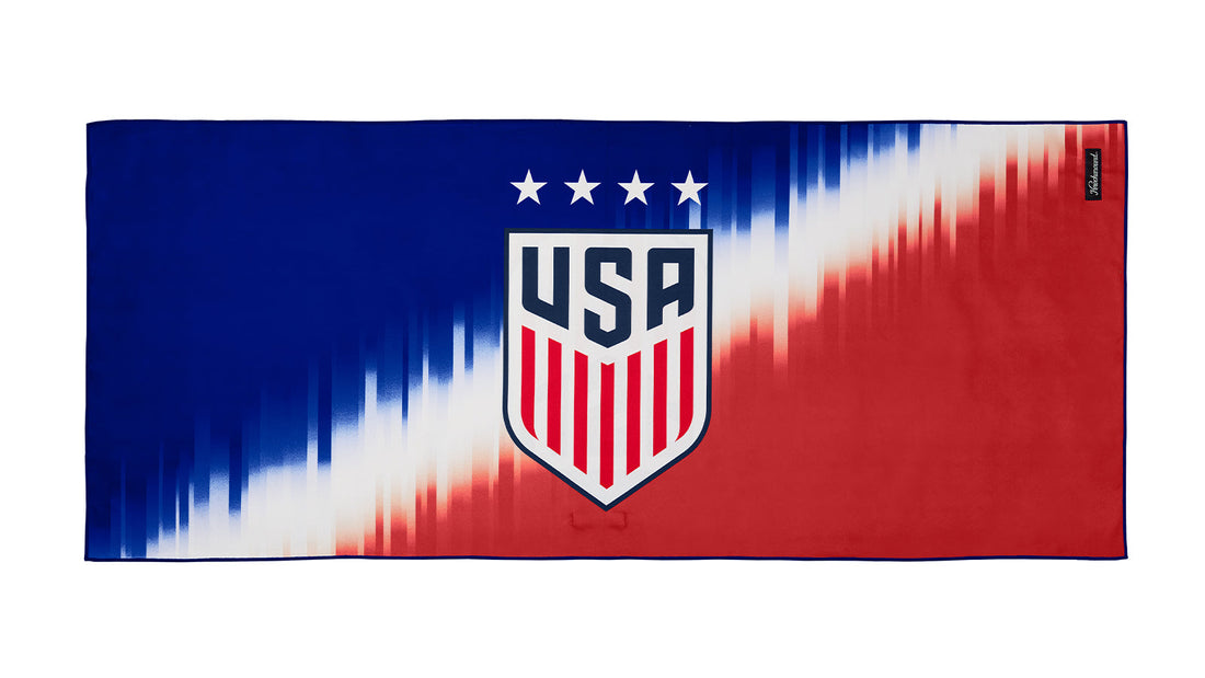 U.S. Soccer 2024 adventure towel with red, white, and blue gradient pattern and US Soccer crest.