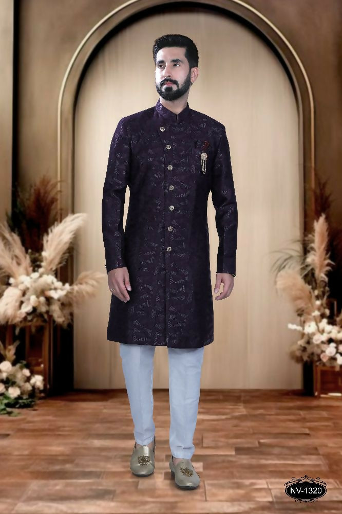A toddler wearing a stylish Wine color self-design Indo-Western kurta with matching pyjama trousers.