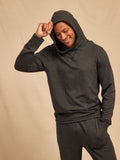 Men wearing a soft, lightweight grey Core Feather Fleece Hoodie with a relaxed fit.