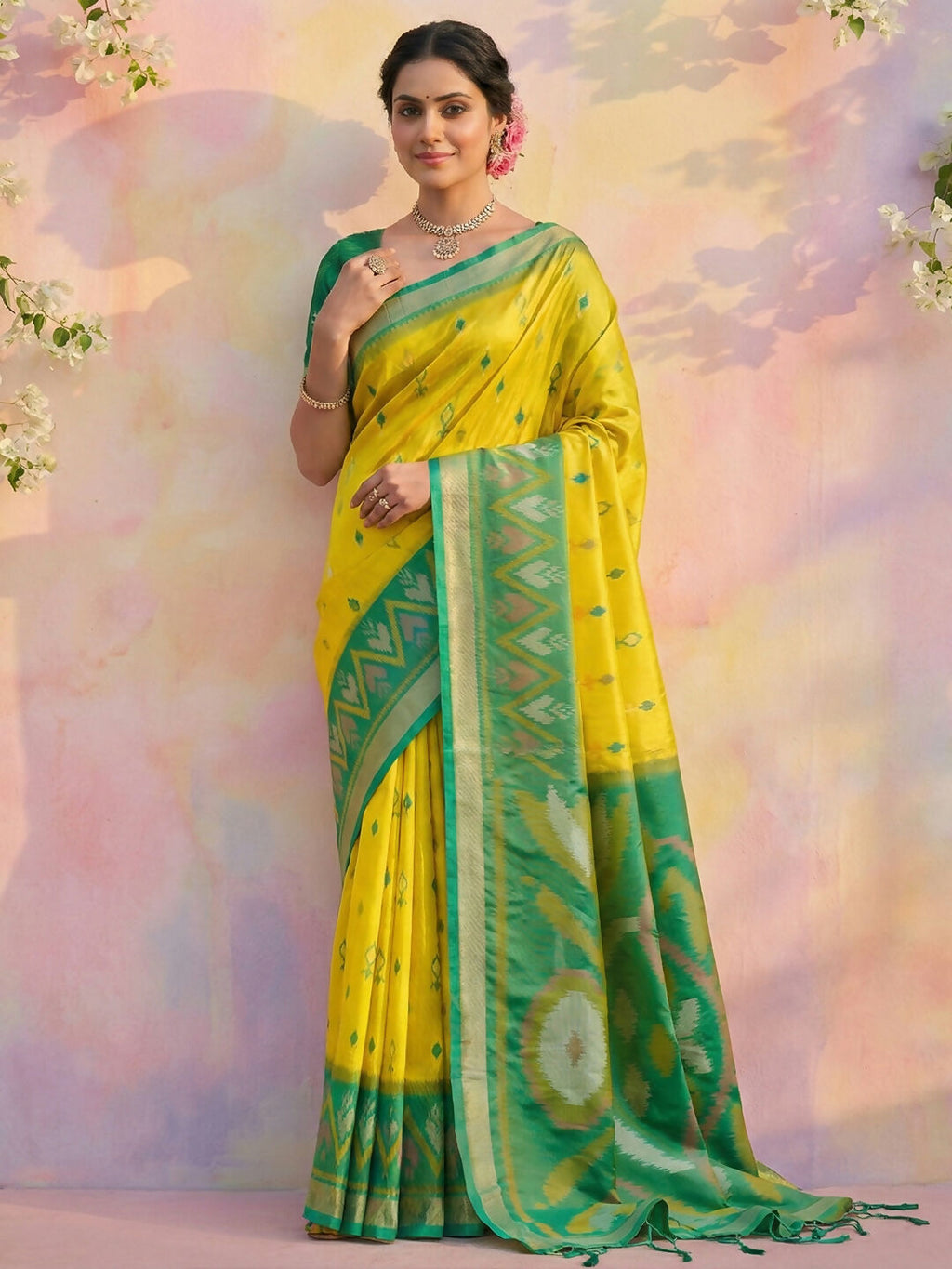 Elegant green soft silk saree with matching blouse piece, draped gracefully.