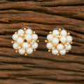 Pair of golden white AD stone earrings crafted from brass