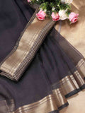 A beautiful grey organza saree with matching blouse fabric for a sophisticated festive look.