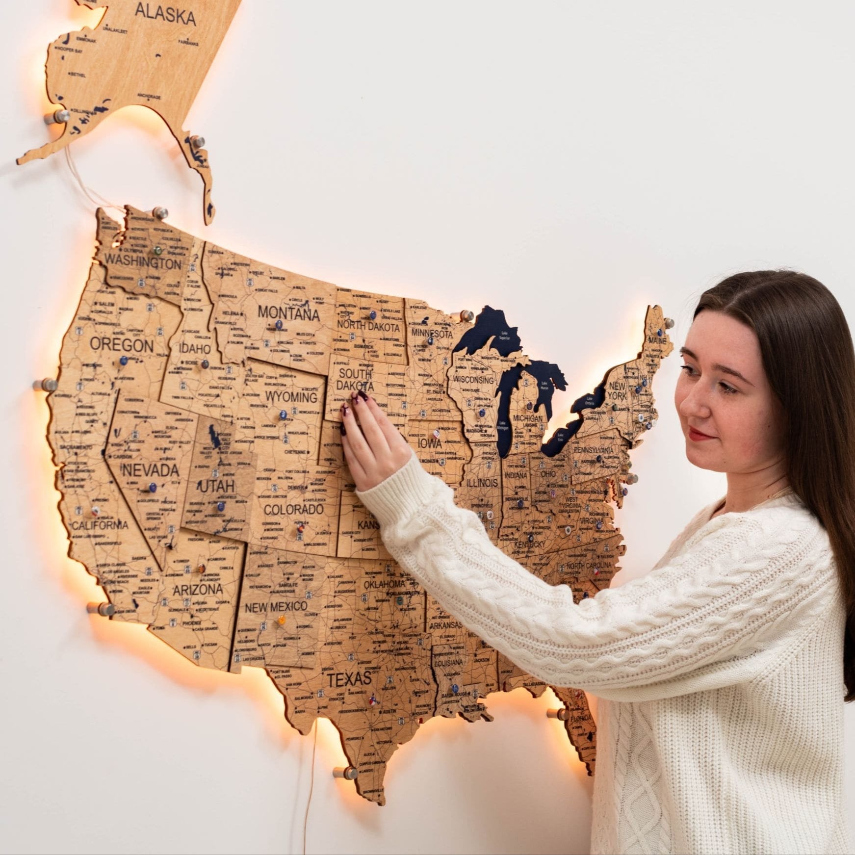 Illuminated 3D LED Wooden USA Map in Gold finish, showcasing ambient lighting on a wall.