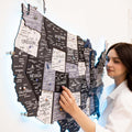 Wooden 3D USA map with ambient LED lighting in a minimalist Nordic-style living room