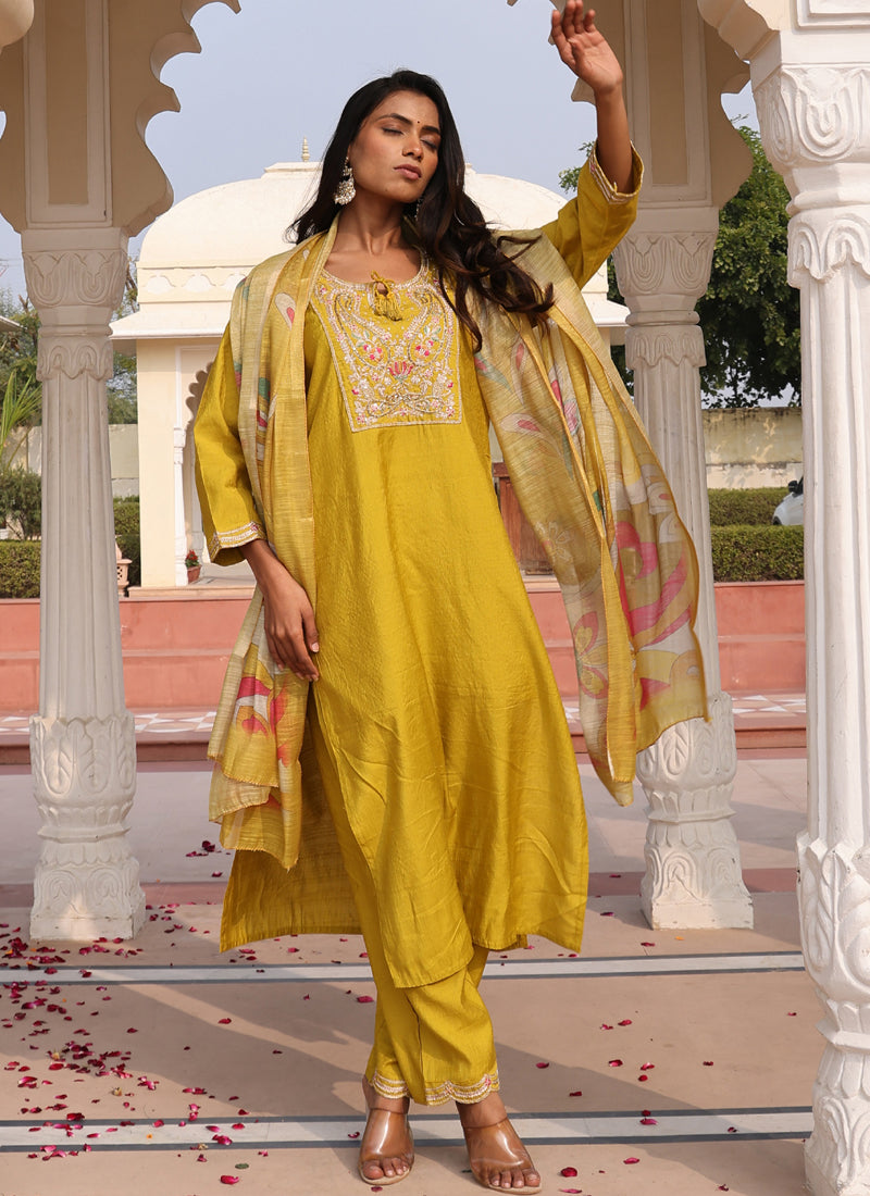 Elegant yellow cotton silk salwar suit with intricate thread and sequins embroidery and matching embroidered pant