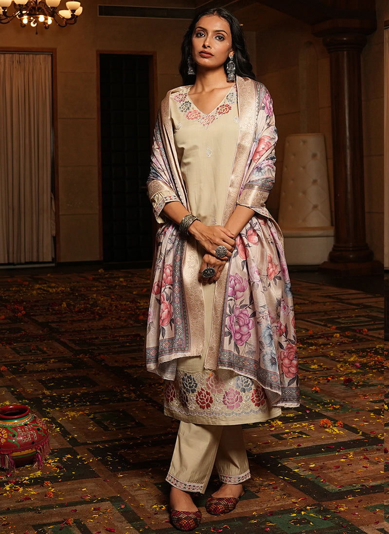 Elegant beige cotton silk designer salwar suit with intricate thread and sequins embroidery and matching embroidered pants.