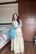 Off White Chinon Silk Sharara suit with sequence embroidery and back tassel dori