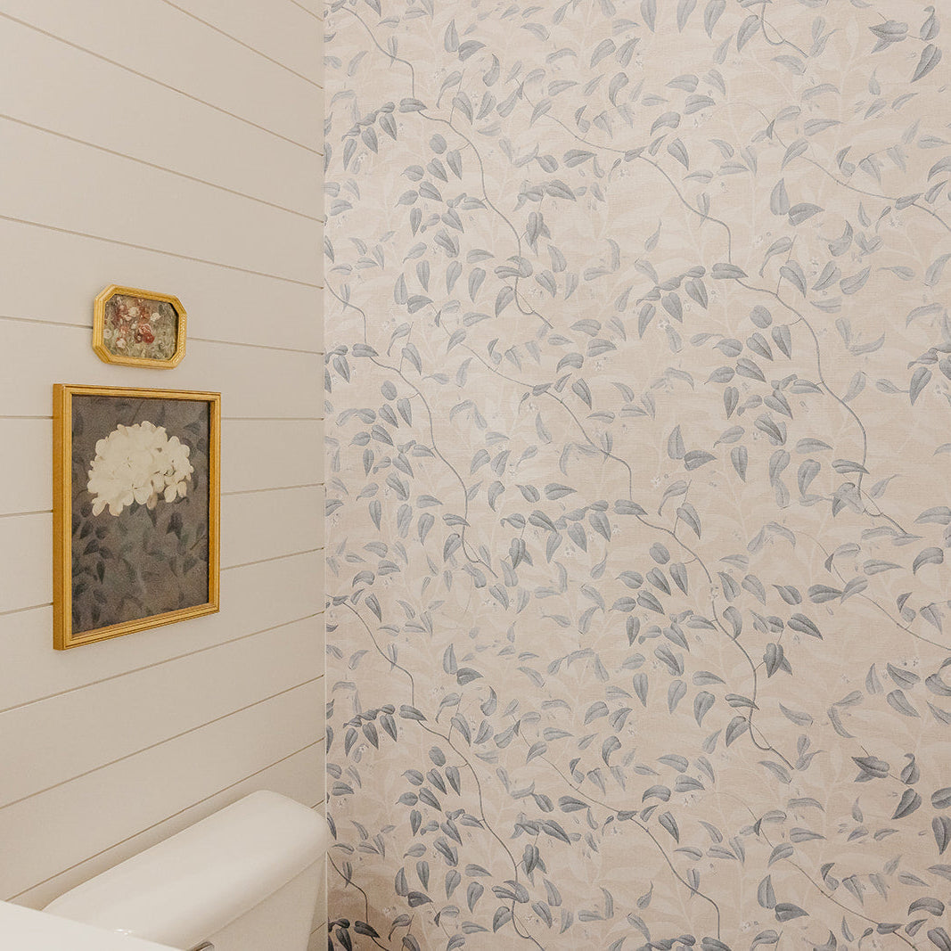 Hollins floral wallpaper in soft blue-grey and beige, showcasing a cottagecore-inspired design.