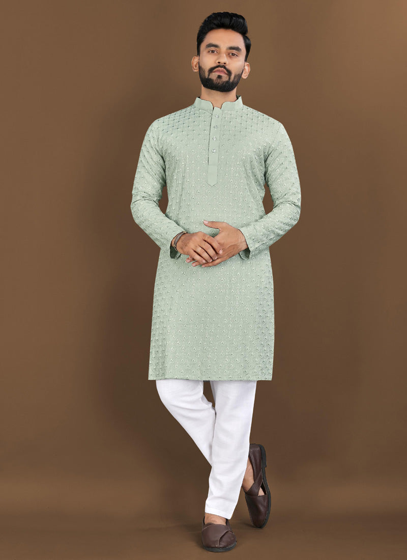Pista green boys' kurta made of rayon with detailed embroidery and matching pajama.