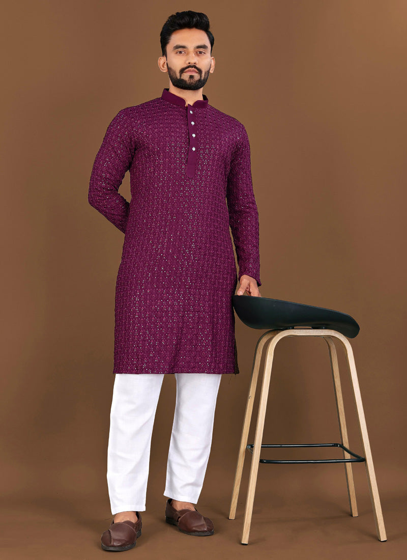 A young boy wearing a wine-colored embroidered rayon kurta with matching pajama set