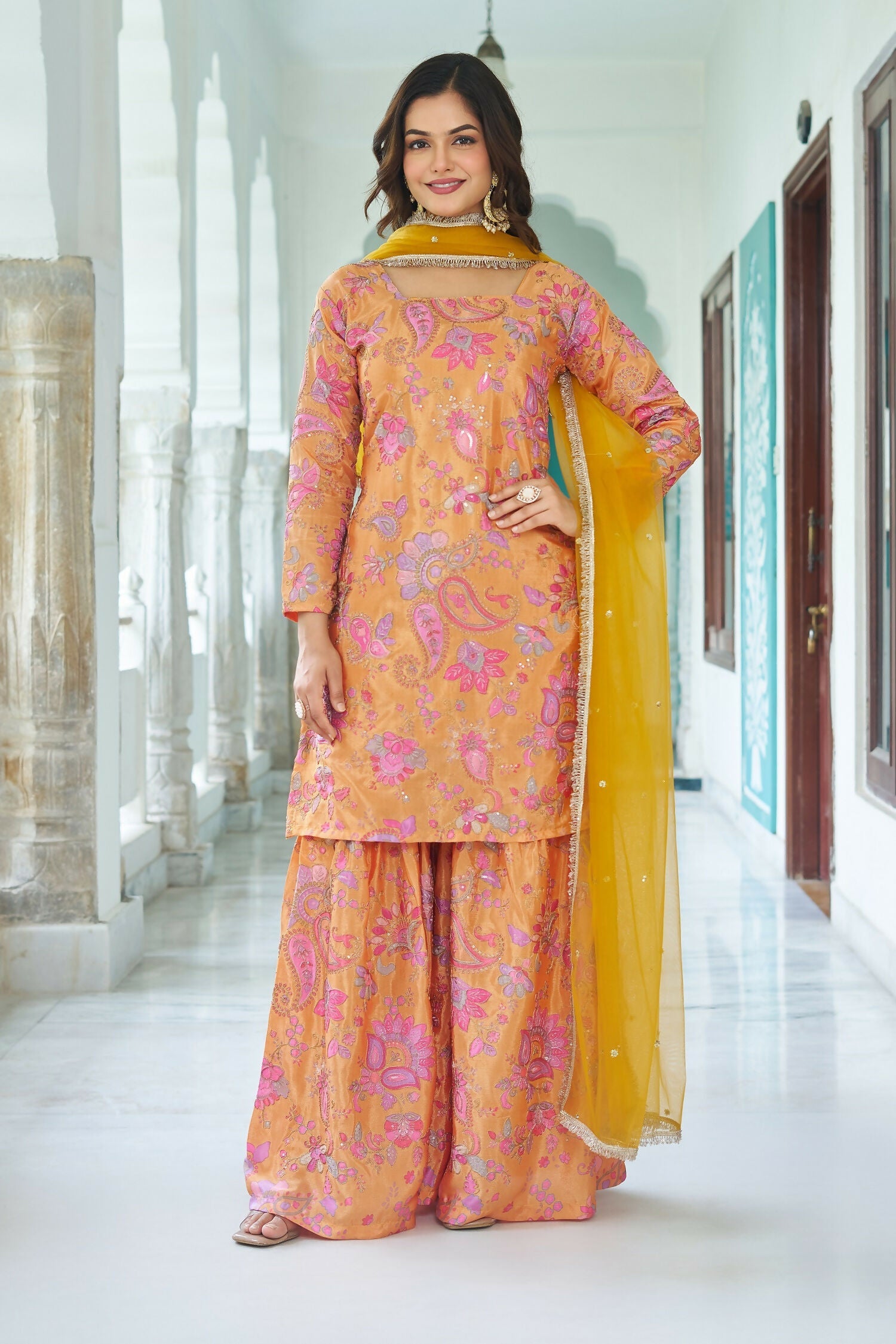 Yellow chinnon kurta set with detailed embroidery and sequence work