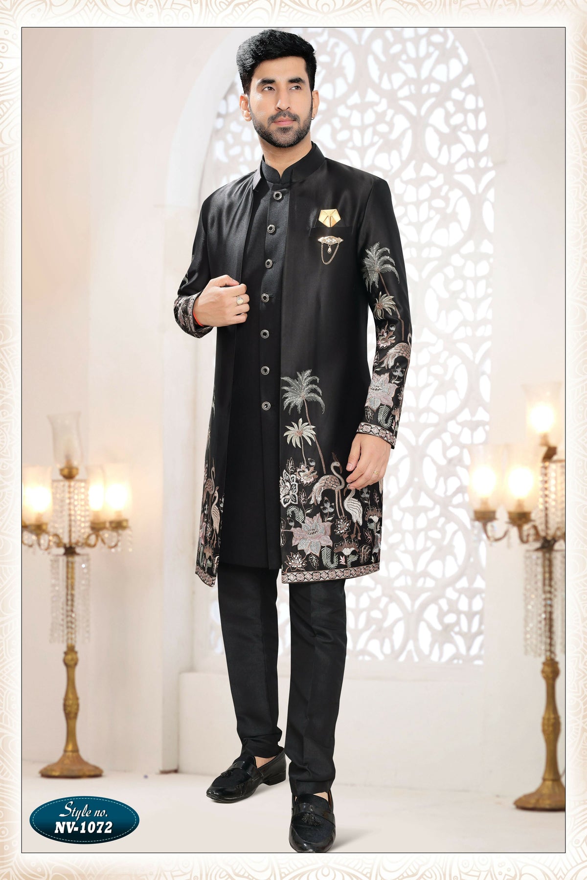 A man wearing a black Malai Silk kurta set with detailed thread and sequence embroidery.