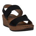 A pair of black wedge sandals with dual Velcro straps and subtle embellishments.