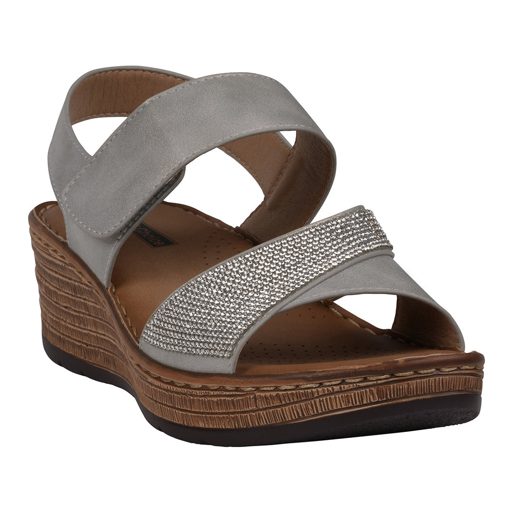 A pair of women's grey wedge sandals with embellished straps and velcro closures displayed on a white background.