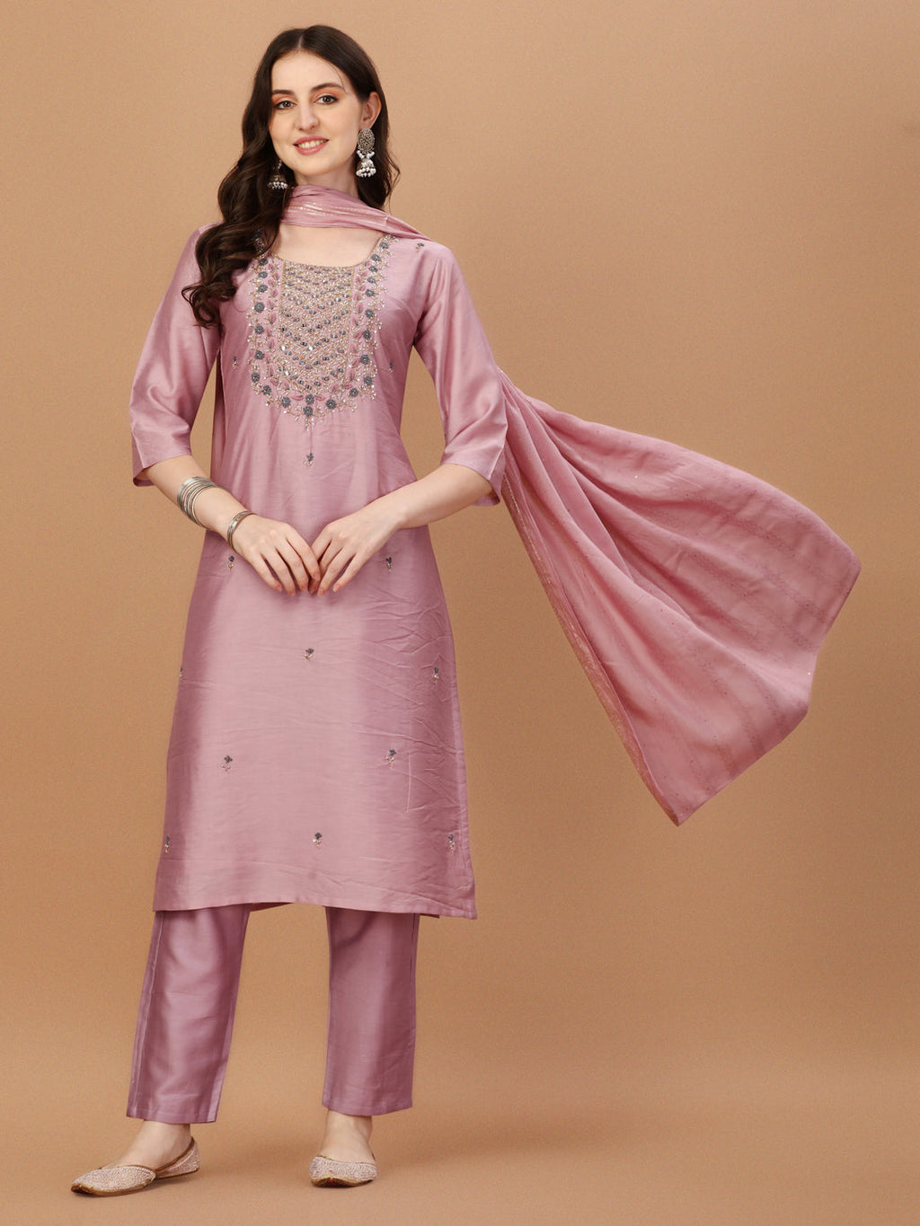 Woman wearing a multicolor embroidered rayon kurta set with pant and matching dupatta