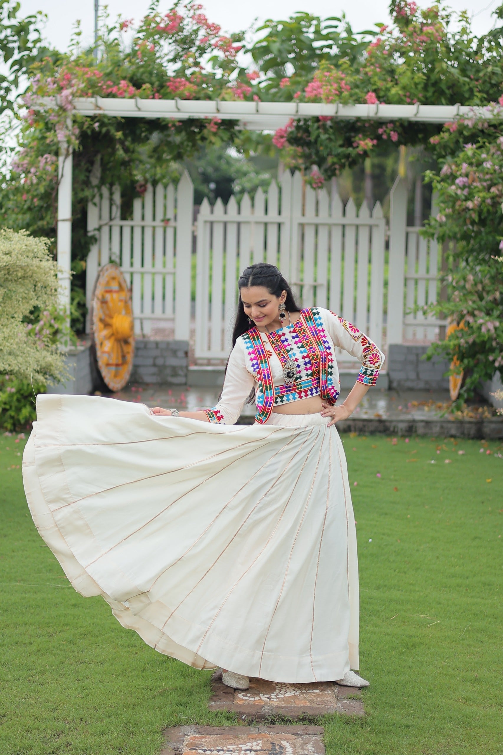 Off White Roman Silk Kutchi Embroidered Navratri Lehenga Set