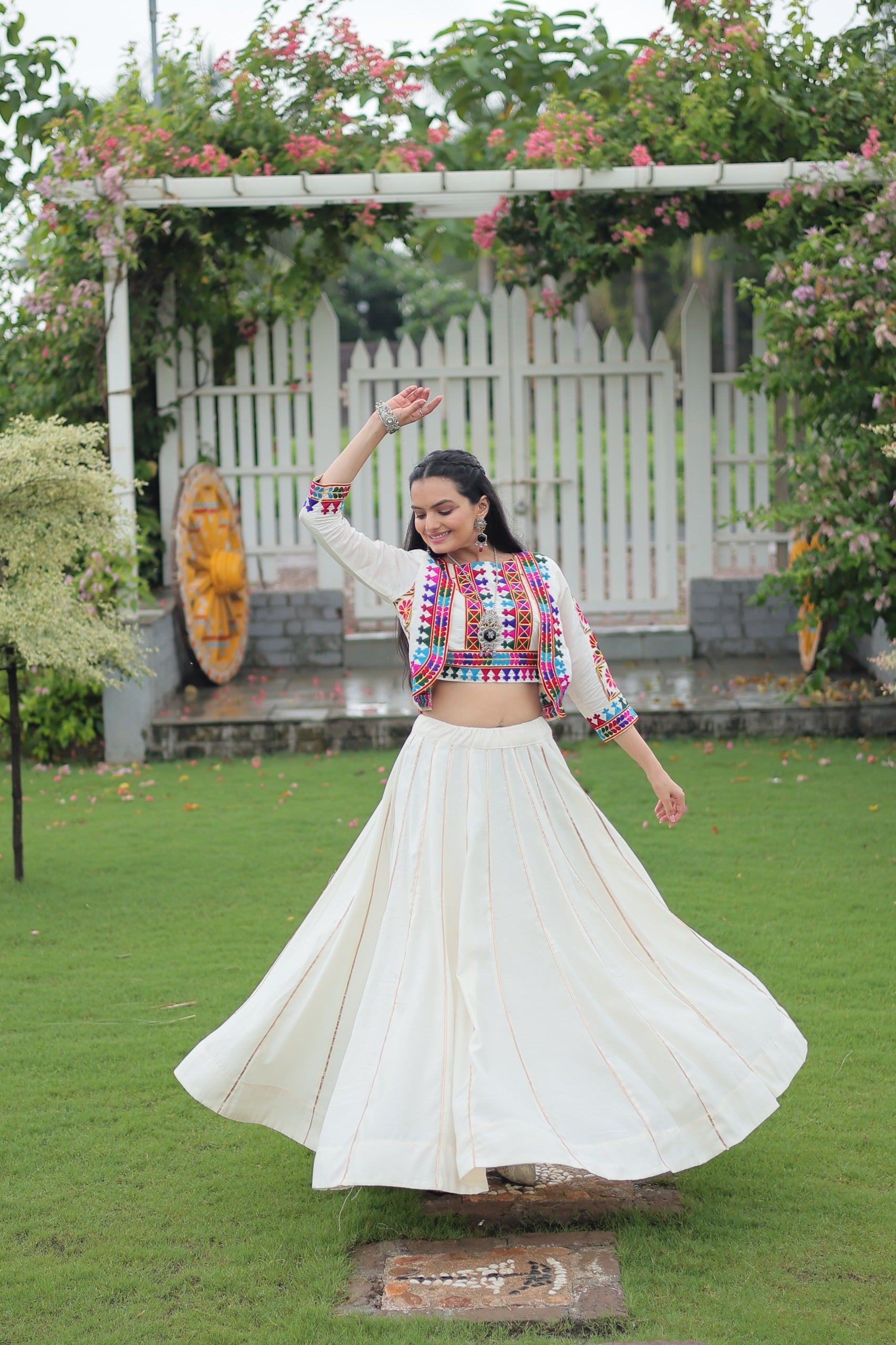 Off White Roman Silk Kutchi Embroidered Navratri Lehenga Set