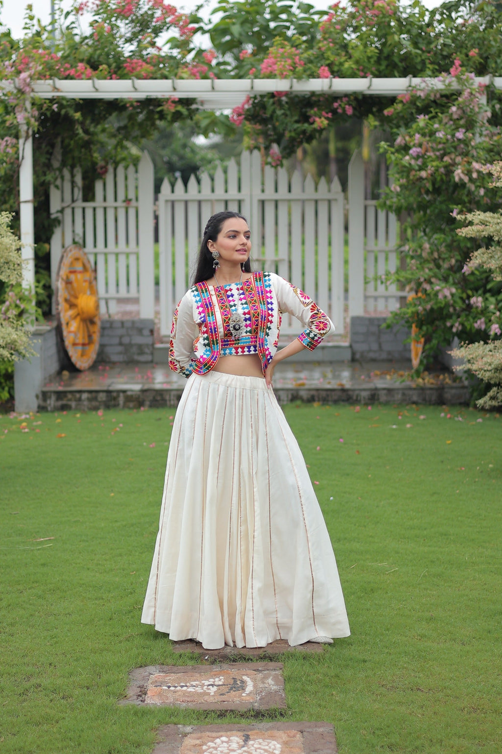Off White Roman Silk lehenga featuring traditional Kutchi embroidery and Gota-Patti lace for Navratri