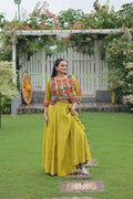 Parrot green Roman silk lehenga with detailed Kutchi Gamthi embroidery and Gota-Patti lace trim