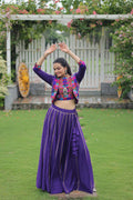Elegant purple Roman Silk lehenga choli featuring attractive Gota-Patti lace work for festive and ethnic events.