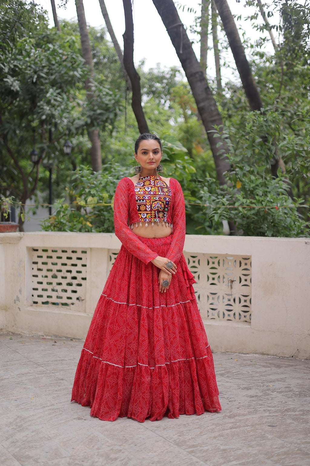 Red faux georgette lehenga featuring traditional Bandhej print and Gotta Patti lace detailing