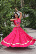Pink Roman silk lehenga featuring intricate Kutchi Gamthi and mirror work