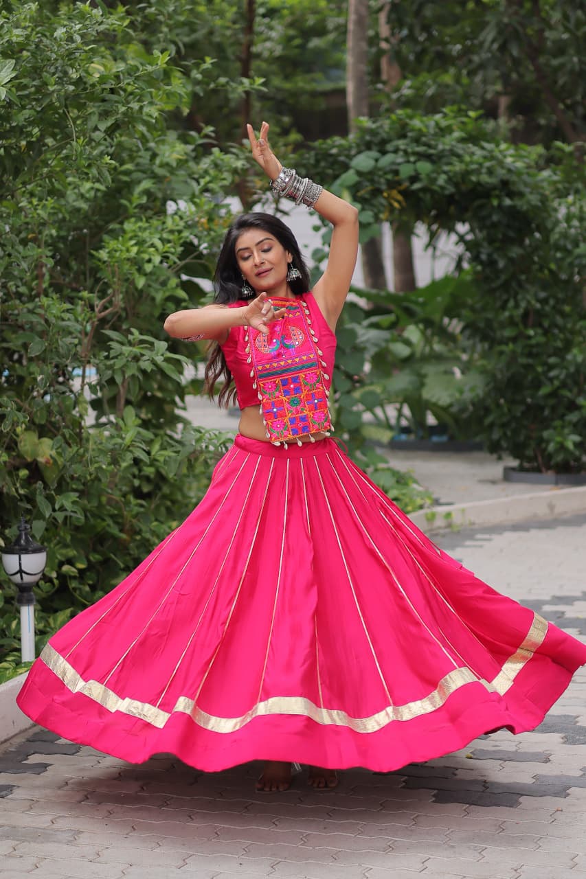 Pink Roman silk lehenga featuring intricate Kutchi Gamthi and mirror work